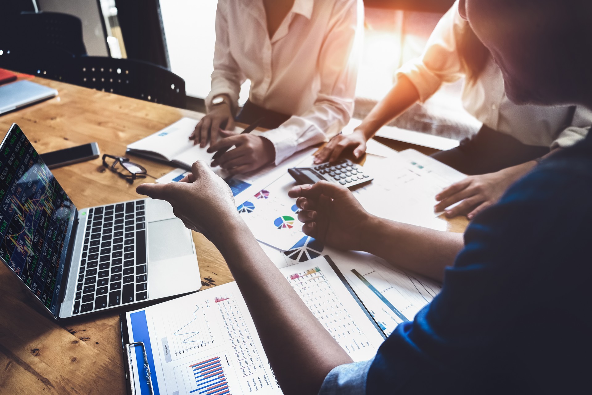 Business financial, accountant discussing with partner are meeting to audit finance planning sales to meet targets set in next year. stock market concept.